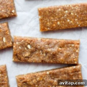 Peanut butter granola bars inspired by Copycat Cashew Cookie Lärabars, served on a piece of paper.
