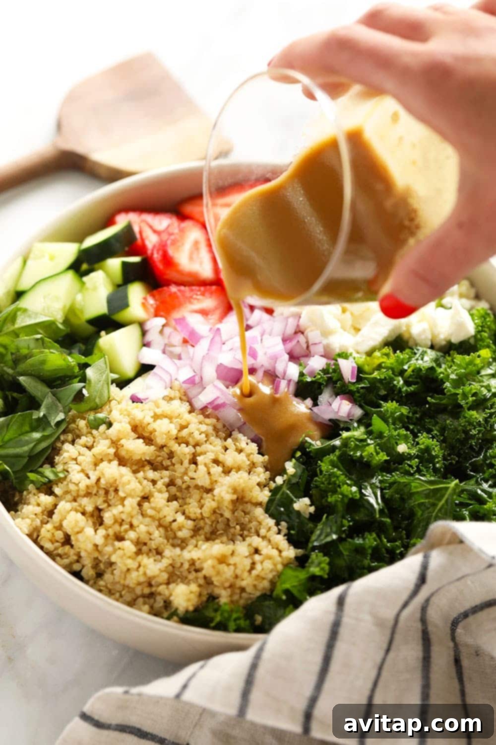 Vibrant Strawberry Quinoa Salad 4 A close-up of the creamy balsamic hummus dressing, ready to be drizzled over the salad.
