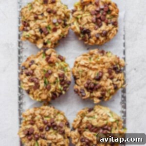 A tray of freshly baked granola muffins cooling on a baking sheet.