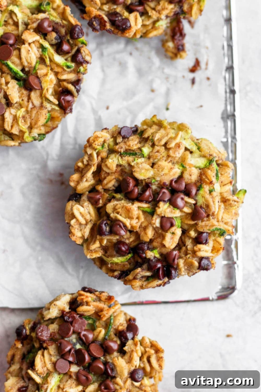 A single baked chocolate chip zucchini oatmeal cup, perfectly portioned and ready to be enjoyed.