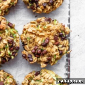 Delicious zucchini chocolate chip muffins on a baking sheet, ready to be enjoyed.