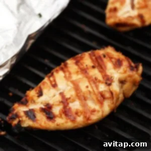 Grilling chicken on grill