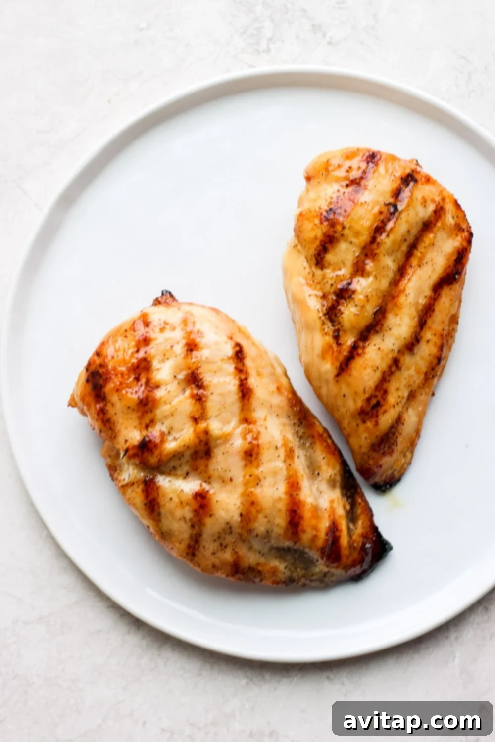 Chargrilled Chicken Garden Salad 3 Two grilled chicken breasts on a plate. Grilled chicken breast is so easy to make! Remember these two things: set your grill to 400ºF and cook your chicken until they reach an internal temperature of 165ºF.