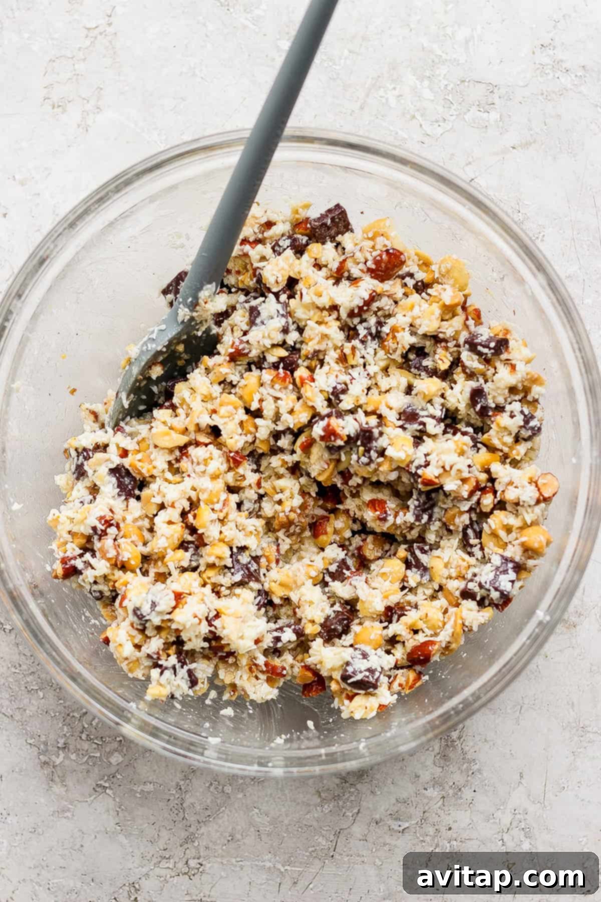 Mixing bowl with nuts, coconut, and chocolate chunks