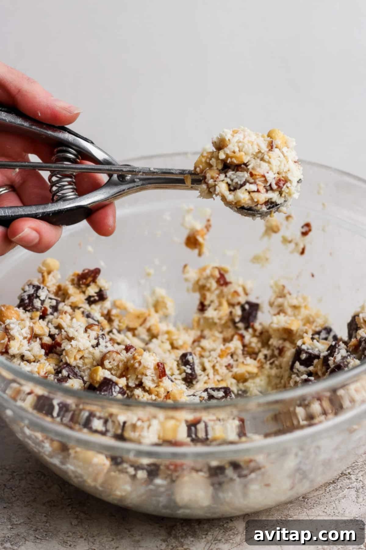 Scooping cookie dough onto a baking sheet