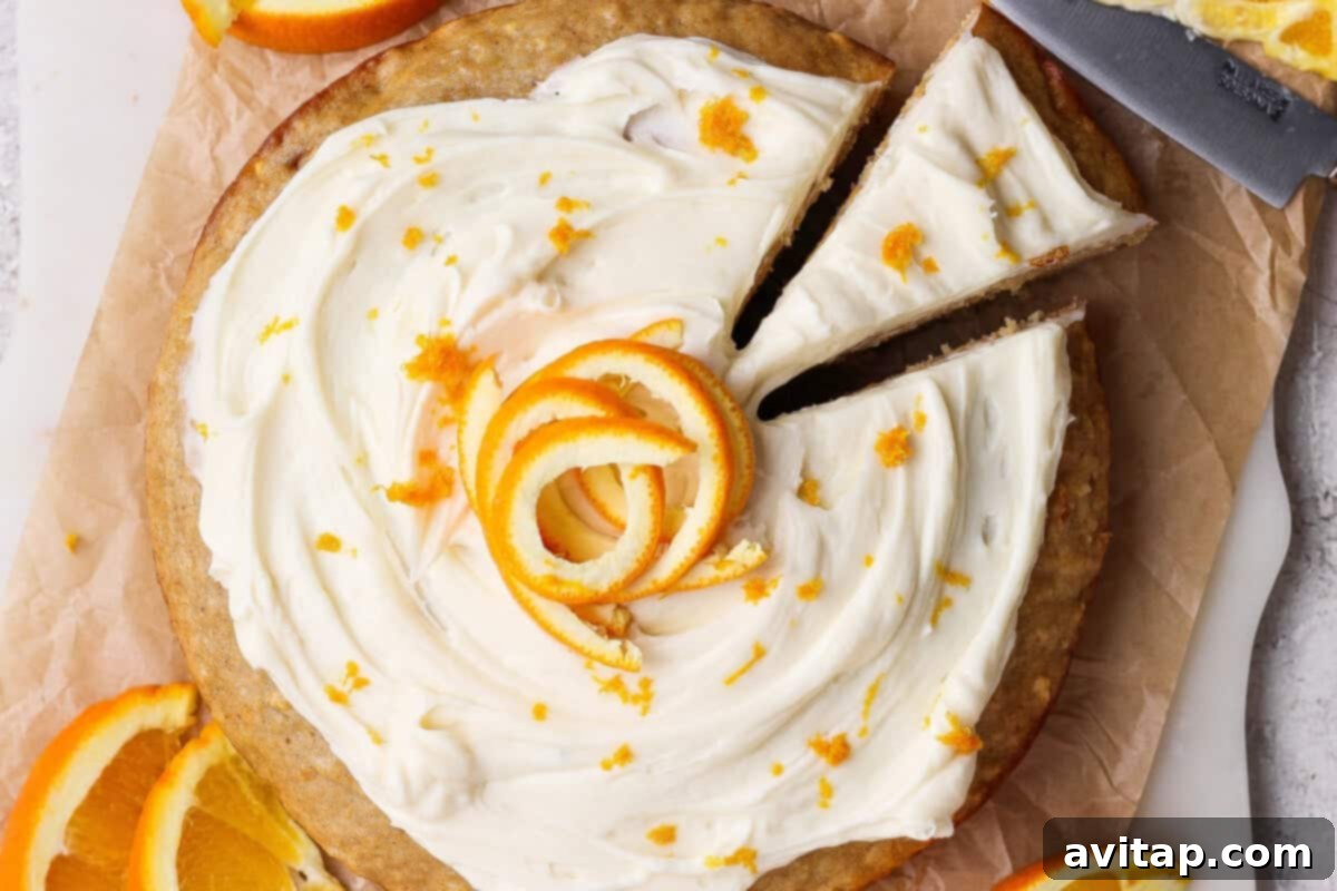 A delicious whole orange cake with cream cheese frosting and orange zest.