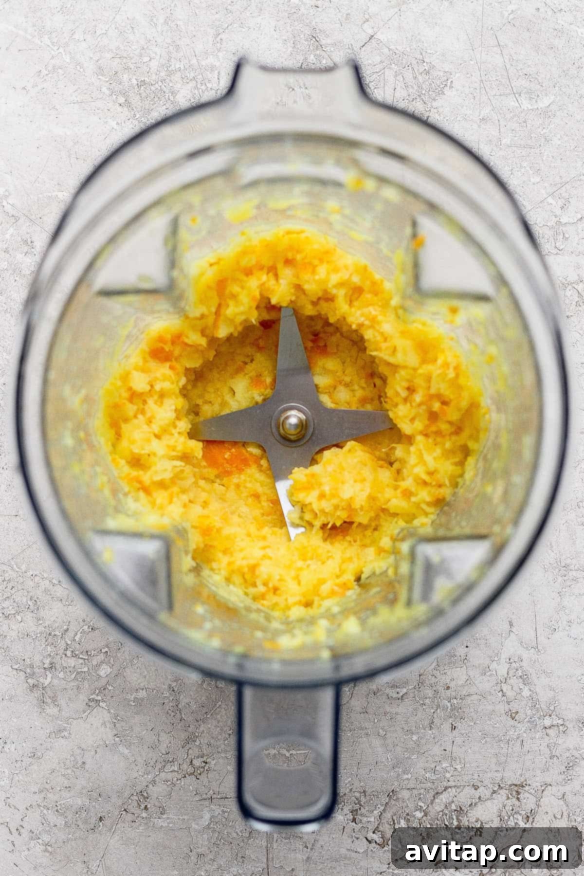 Blending the boiled orange in a high-speed blender.