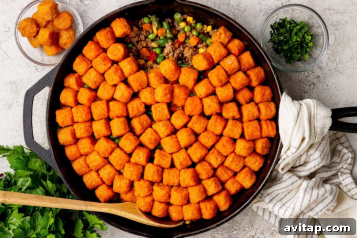 Sweet Potato Tater Tot Casserole in a skillet