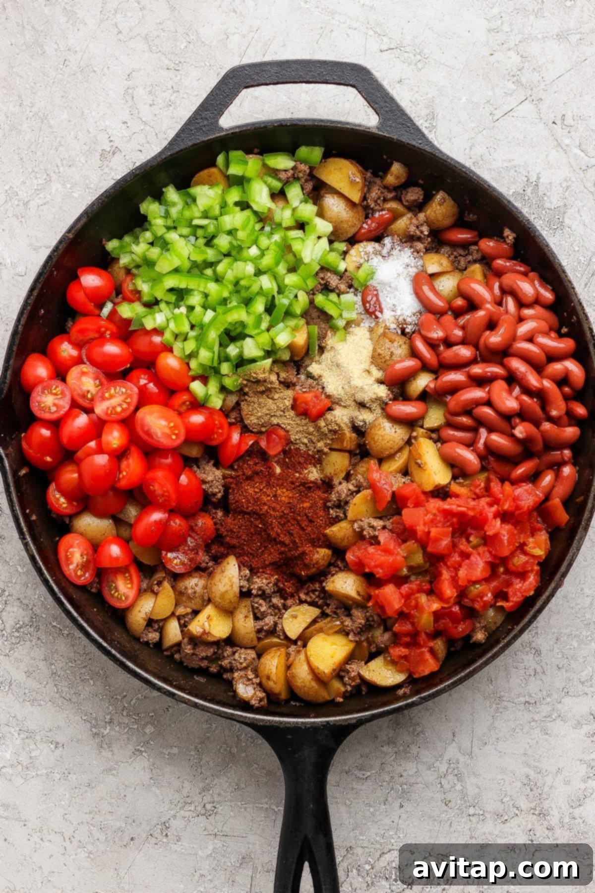 All ingredients combined in a skillet before cooking.