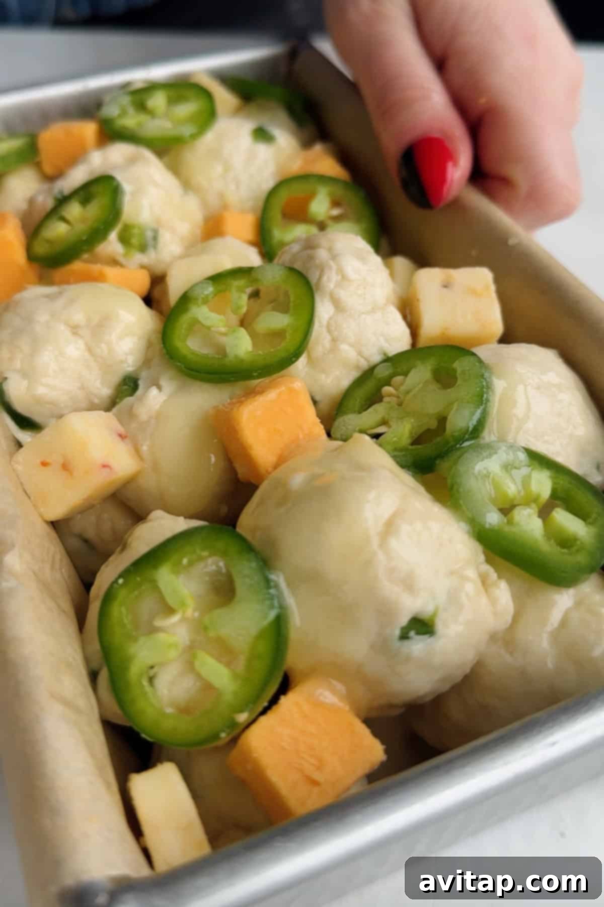 Unbaked pull-apart bread in a pan
