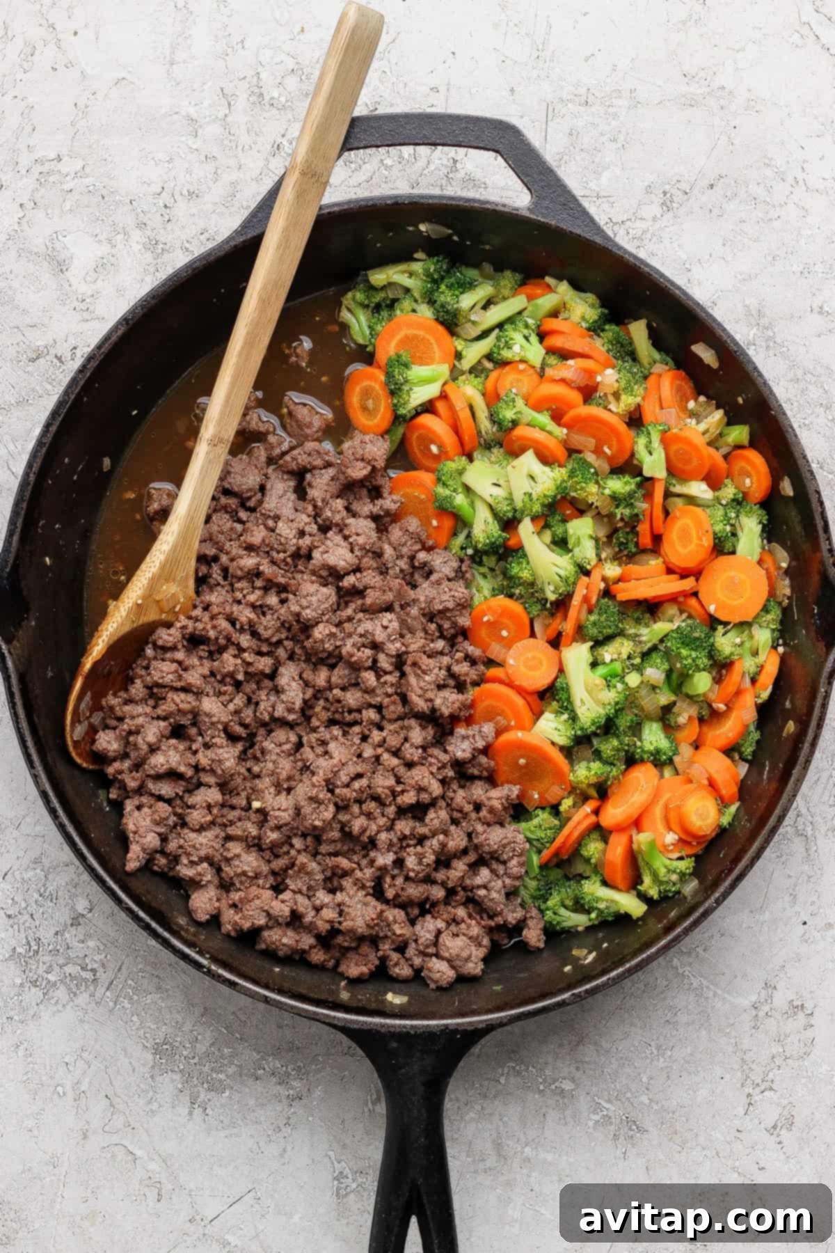 Ground Beef with Broccoli Florets 5 Cooked ground beef added to the skillet with sautéed vegetables.