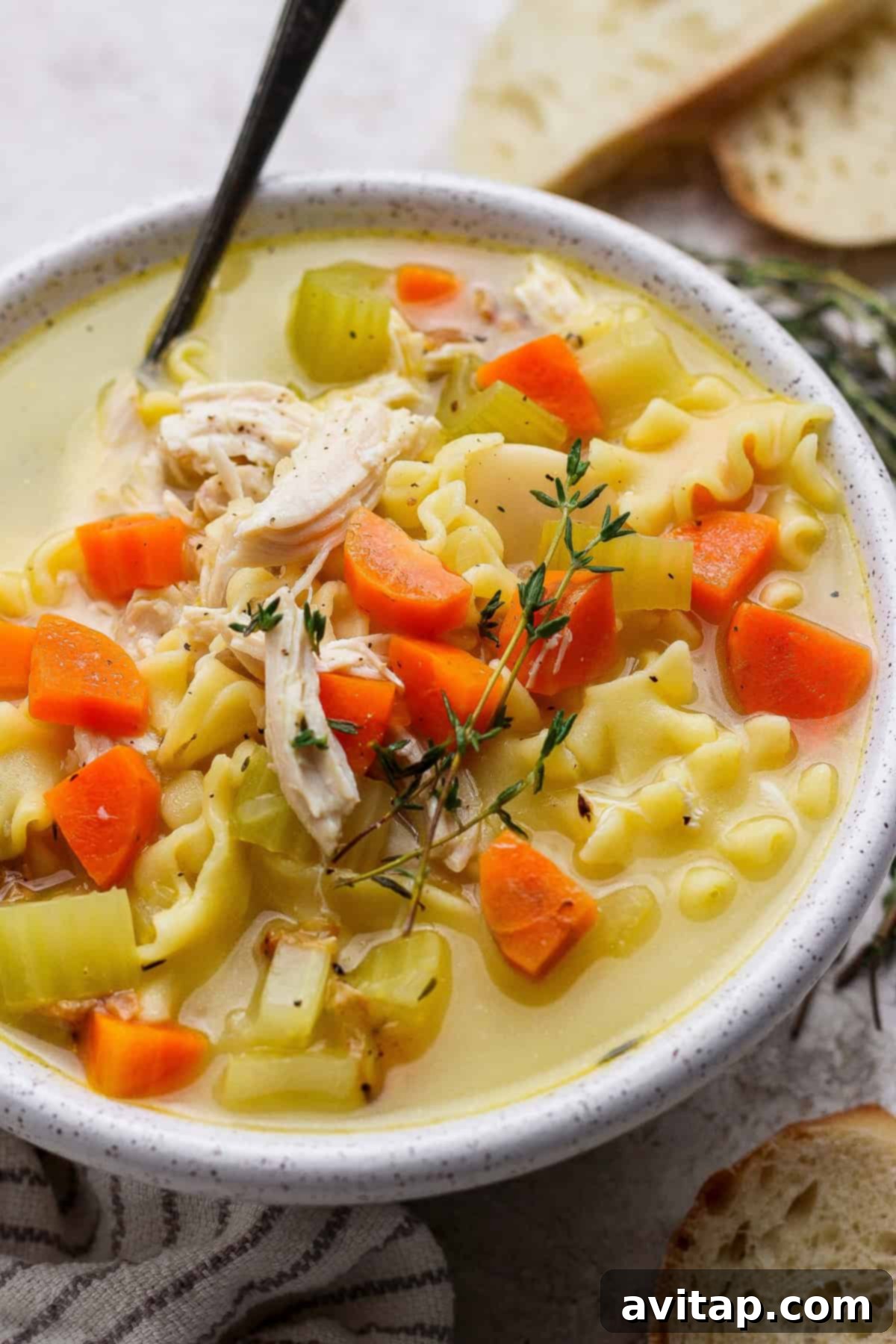 Another delicious serving of high protein creamy chicken soup with a side of crusty bread.