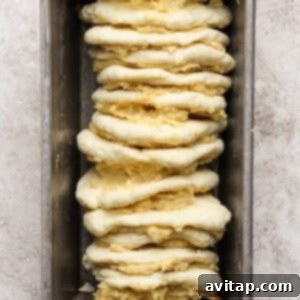 Assembling pull-apart bread in a loaf pan