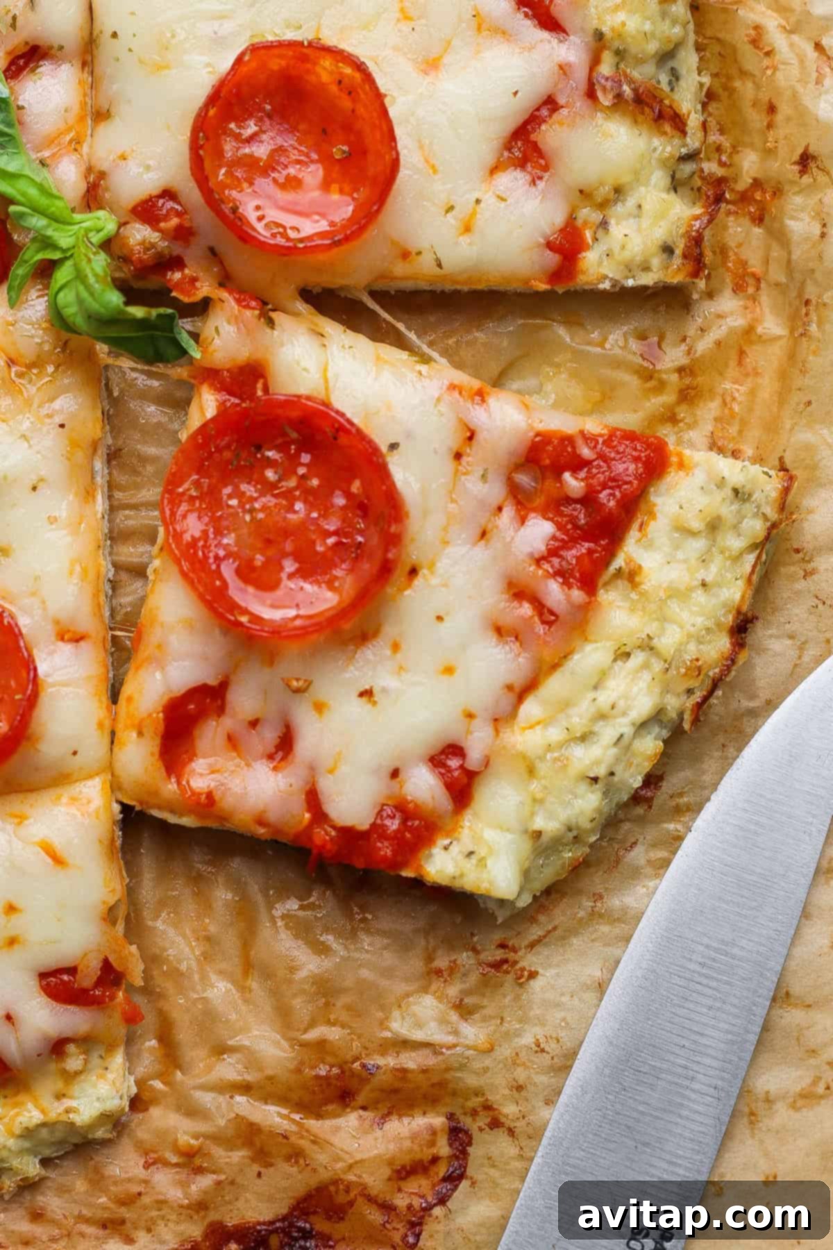 Close-up shot of a flavorful slice of chicken crust pizza, revealing the crispy crust and melted cheese.
