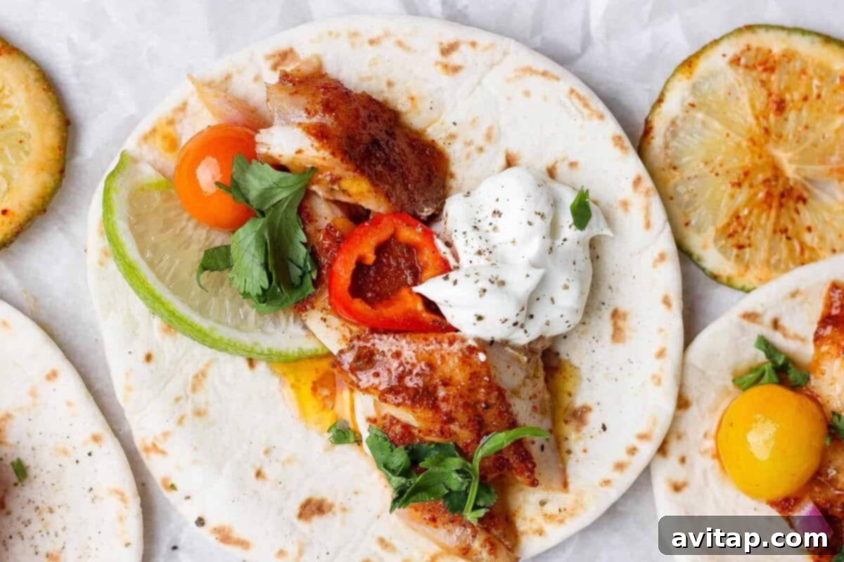 A delicious chile lime fish taco with fresh toppings.