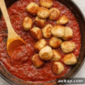 Simmering meatballs in sauce