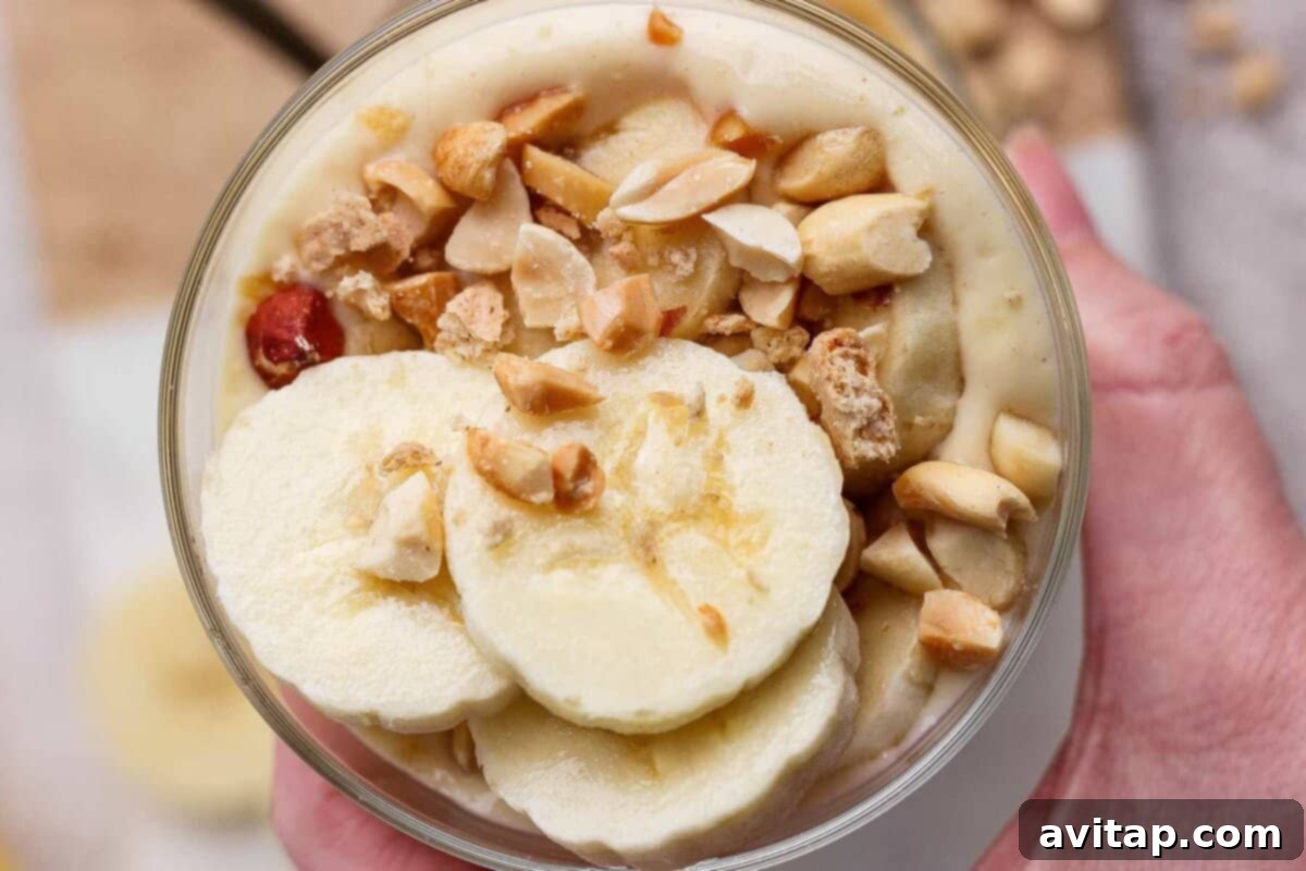 High-Protein Banana Bliss 2 Creamy high-protein banana pudding topped with banana slices and peanuts