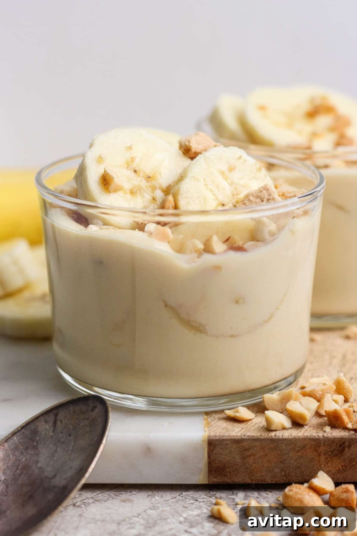 High-Protein Banana Bliss 8 Glass cup of banana pudding with toppings