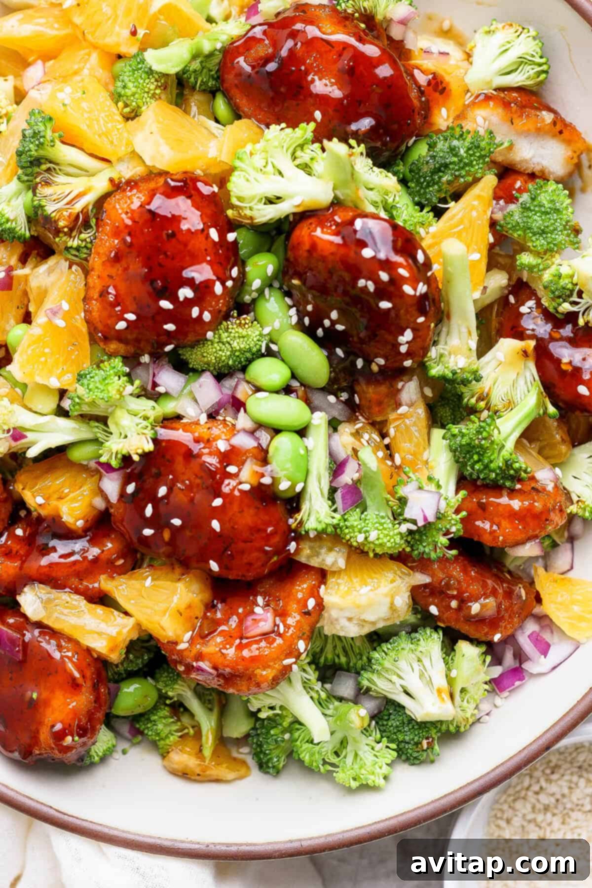 Close-up of the finished Crispy Chicken Teriyaki with Broccoli Orange Salad.