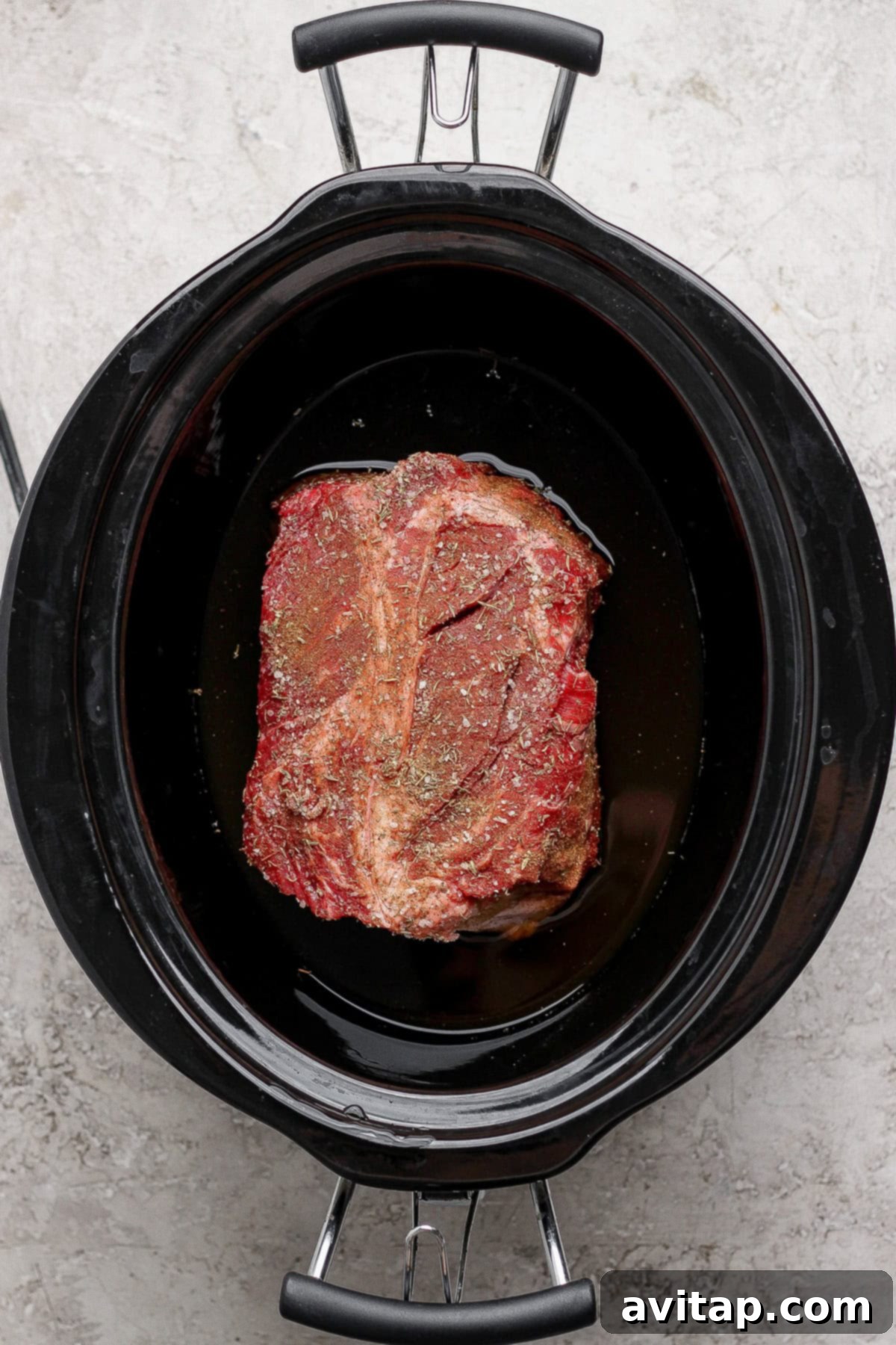 Chuck roast in slow cooker with broth