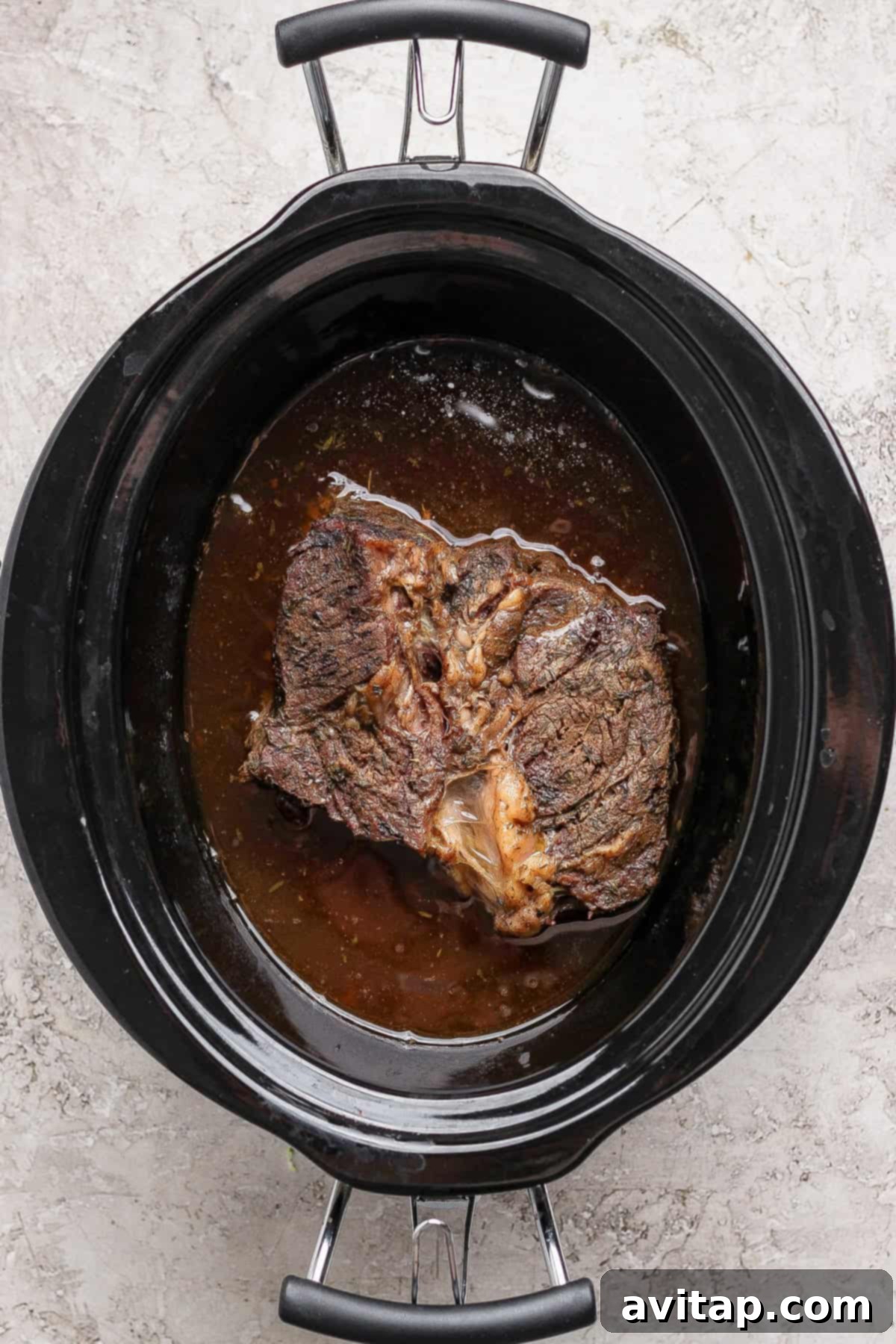 Cooked chuck roast in slow cooker