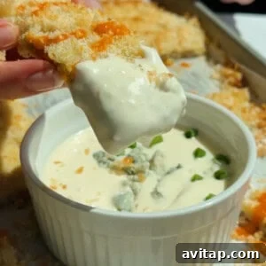 Buffalo Chicken Protein Bars — Crispy Baked Snackable Bars 10 Chicken protein bars served with blue cheese dip garnished with fresh herbs and crumbled cheese