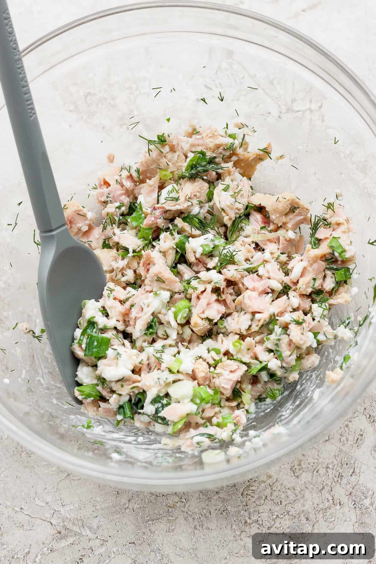 cottage cheese tuna salad mixed in glass bowl