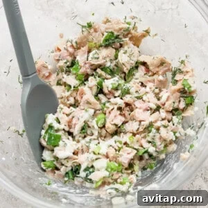 cottage cheese tuna salad mixed in glass bowl
