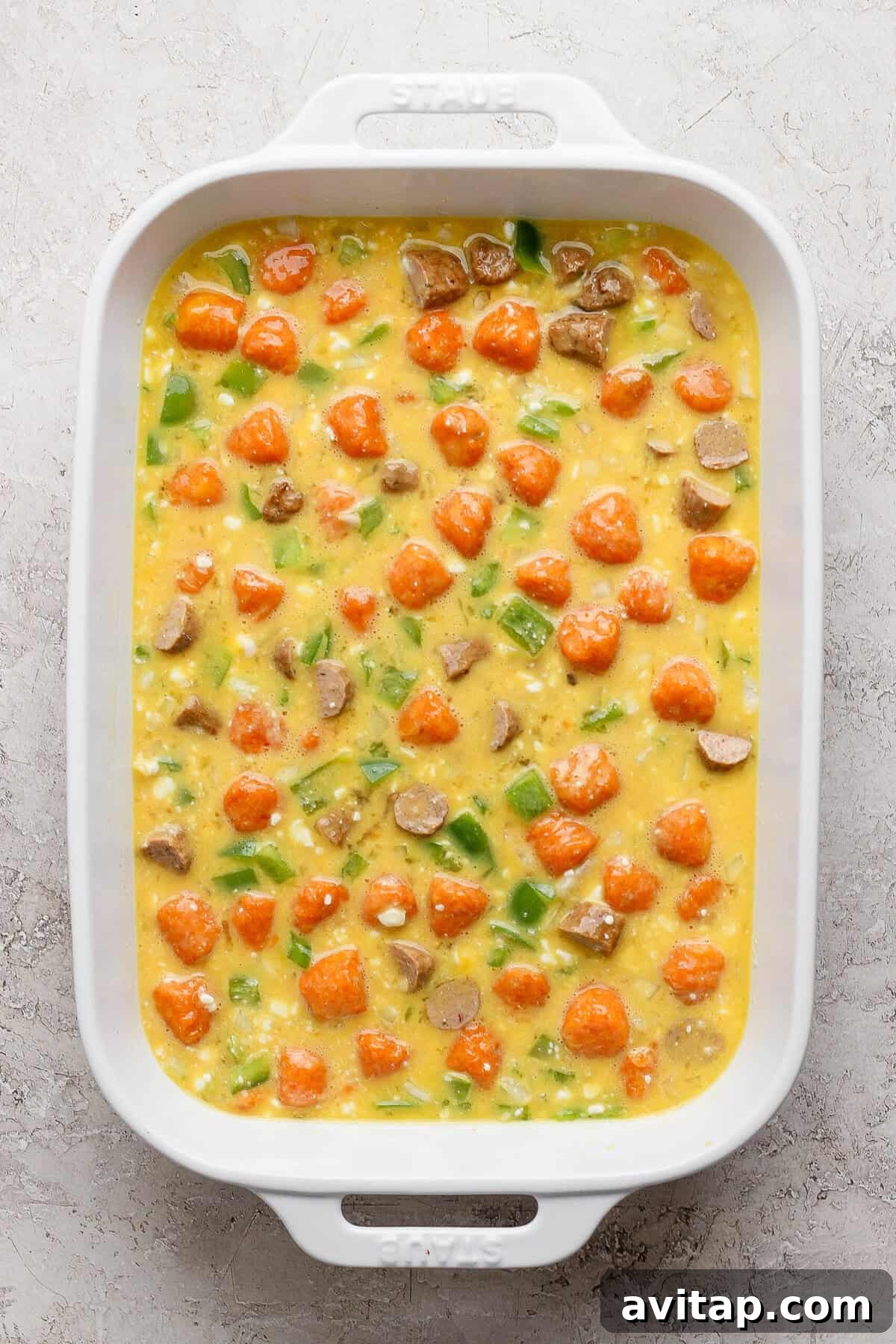 sweet potato breakfast casserole mixed together and ready to bake