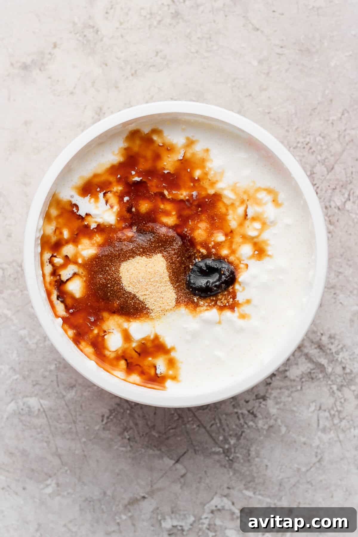Cottage cheese topped with Worcestershire sauce, beef broth concentrate, and garlic powder before blending.